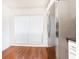 Bright kitchen featuring hardwood floors and a stainless steel refrigerator, complemented by natural light from a window at 2901 Lenox Ne Way # 902, Atlanta, GA 30324
