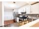 This kitchen boasts granite countertops, stainless appliances, and wood flooring at 2901 Lenox Ne Way # 902, Atlanta, GA 30324