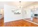 Open layout with hardwood floors provides view to kitchen through mirrored wall and open doorway at 2901 Lenox Ne Way # 902, Atlanta, GA 30324