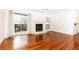 Open living room with a fireplace, sliding glass doors, and hardwood floors at 2901 Lenox Ne Way # 902, Atlanta, GA 30324