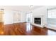 Spacious living room with hardwood floors, fireplace, and a glass door to the outside at 2901 Lenox Ne Way # 902, Atlanta, GA 30324