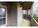 A covered patio with brick and wood elements provides a relaxing outdoor space at 2901 Lenox Ne Way # 902, Atlanta, GA 30324