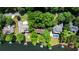 Aerial view of lakeside houses, pool, and docks at 3800 Schooner Rdg, Alpharetta, GA 30005