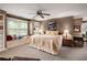 Cozy bedroom with a window seat, built-in bookshelves, and a ceiling fan at 3800 Schooner Rdg, Alpharetta, GA 30005