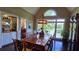 Formal dining room with a long table, elegant chandelier, and scenic lake view, great for entertaining at 3800 Schooner Rdg, Alpharetta, GA 30005