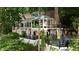 Back of the house with multiple decks surrounded by trees at 3800 Schooner Rdg, Alpharetta, GA 30005