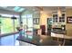 Modern kitchen boasts granite countertops, stainless steel appliances, and a breakfast bar overlooking the backyard at 3800 Schooner Rdg, Alpharetta, GA 30005
