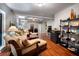 Stylish living room with hardwood floors, tray ceiling, and ample seating at 3800 Schooner Rdg, Alpharetta, GA 30005