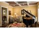 Cozy living room featuring a coffered ceiling, grand piano, and comfortable seating with a floral area rug at 3800 Schooner Rdg, Alpharetta, GA 30005