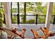 Relaxing porch with wooden chairs and a view of the lake at 3800 Schooner Rdg, Alpharetta, GA 30005