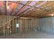 Unfinished basement with open framework and visible insulation, offering a blank canvas for customization at 522 Spring View Dr, Woodstock, GA 30188