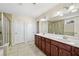 Large bathroom features double vanity, walk in shower and soaking tub with tiled walls at 522 Spring View Dr, Woodstock, GA 30188
