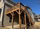 Exterior view of the deck with stairs leading to the backyard, enhancing outdoor living and entertainment at 522 Spring View Dr, Woodstock, GA 30188