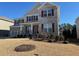Charming two-story home with brick and siding accents, complemented by a green lawn at 522 Spring View Dr, Woodstock, GA 30188