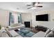 Cozy living area features a fireplace, large screen television, and ample seating at 522 Spring View Dr, Woodstock, GA 30188