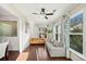 Bright living room features hardwood floors, modern furniture, and large windows for ample natural light at 522 Spring View Dr, Woodstock, GA 30188