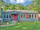 Charming blue home with a red door and red shutters on the windows at 2404 Shallowford Ter, Atlanta, GA 30341