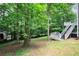Picturesque backyard with a multi-level deck, offering a serene, wooded view and private outdoor space at 2990 Hearthstone Dr, Cumming, GA 30041