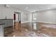 Finished basement with dark marbled floors, wet bar, and a walkout to the back yard at 2990 Hearthstone Dr, Cumming, GA 30041