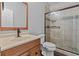 Updated bathroom featuring a glass shower with custom tile work and modern fixtures at 2990 Hearthstone Dr, Cumming, GA 30041