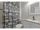 Modern bathroom with shower and tub combination and stylish black and white shower curtain at 2990 Hearthstone Dr, Cumming, GA 30041
