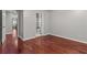 This bedroom features hardwood floors and an ensuite bathroom for added privacy and convenience at 2990 Hearthstone Dr, Cumming, GA 30041