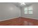 Bedroom with hardwood floors, natural light, neutral paint color, and closet at 2990 Hearthstone Dr, Cumming, GA 30041