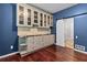 Charming butler's pantry featuring custom cabinets, countertops, and a modern barn door at 2990 Hearthstone Dr, Cumming, GA 30041