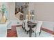 Dining room with soaring windows, wainscoting, hardwood floors, and easy access to upper floors at 2990 Hearthstone Dr, Cumming, GA 30041