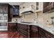 Kitchen with granite countertops, custom cabinetry, and a built in range at 2990 Hearthstone Dr, Cumming, GA 30041