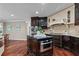 Gourmet kitchen with custom cabinets, granite countertops, and stainless steel appliances at 2990 Hearthstone Dr, Cumming, GA 30041