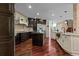 Kitchen featuring custom cabinetry, stainless steel appliances, and a large island at 2990 Hearthstone Dr, Cumming, GA 30041