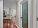 Hallway view highlighting the pantry with custom glass door in open concept living space at 2990 Hearthstone Dr, Cumming, GA 30041