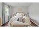 Comfortable bedroom featuring a queen size bed with decorative pillows at 3663 Essex Ave # 29, Atlanta, GA 30339