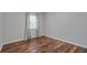 This bedroom features wood floors and neutral paint at 3663 Essex Ave # 29, Atlanta, GA 30339