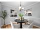 Cozy dining room features modern decor, a round table with four chairs, and a view into the kitchen at 3663 Essex Ave # 29, Atlanta, GA 30339
