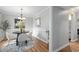 Cozy dining room with round table, four chairs, modern decor, and a view into the adjacent kitchen at 3663 Essex Ave # 29, Atlanta, GA 30339