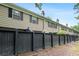 Exterior view of the townhome, showing the black fence surrounding the property at 3663 Essex Ave # 29, Atlanta, GA 30339