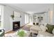 Open living space with a fireplace, built-in shelving, and access to the backyard at 3663 Essex Ave # 29, Atlanta, GA 30339