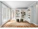 Bright living room with French doors, hardwood floors, built-in shelving, and view to backyard at 3663 Essex Ave # 29, Atlanta, GA 30339