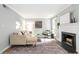 Bright living room featuring a fireplace and view to the outdoors at 3663 Essex Ave # 29, Atlanta, GA 30339