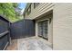 Private patio area with tiled surface and access to the home via glass doors at 3663 Essex Ave # 29, Atlanta, GA 30339