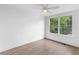 The bare bedroom is spacious with hardwood floors, white walls, and natural light from windows at 75 Mayson Ne Ave, Atlanta, GA 30307