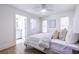 Comfortable bedroom leads to a bright white bathroom, adorned with ample natural light at 75 Mayson Ne Ave, Atlanta, GA 30307