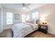 Bright bedroom features a ceiling fan, hardwood floors, and ample natural light from two windows at 75 Mayson Ne Ave, Atlanta, GA 30307