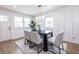 Inviting dining room with modern table, comfortable seating, and decorative wall paneling offering style and comfort at 75 Mayson Ne Ave, Atlanta, GA 30307