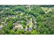 Aerial view of neighborhood, showcasing lush tree cover among the homes at 10830 Carrara Cv, Alpharetta, GA 30022