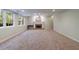 Finished basement with a brick fireplace, neutral carpet and bright, natural light at 10830 Carrara Cv, Alpharetta, GA 30022