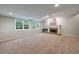 Finished basement with a fireplace and large windows for natural light at 10830 Carrara Cv, Alpharetta, GA 30022