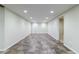 Open basement area featuring recessed lighting and stylish tile flooring at 10830 Carrara Cv, Alpharetta, GA 30022